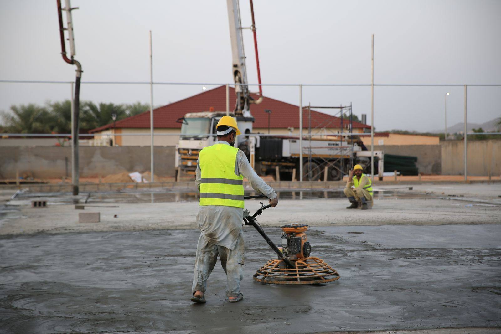 A crew working on a concrete floor